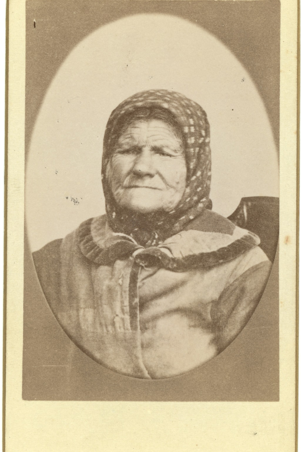 A faded 1870 memorial portrait Before
